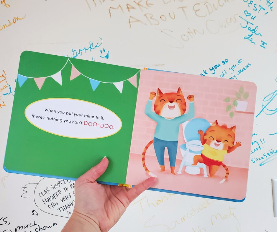 Children's book with a tiger character on a white surface with writing.