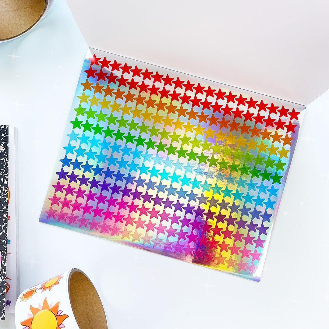 Sheet of colorful star-shaped stickers on a white surface