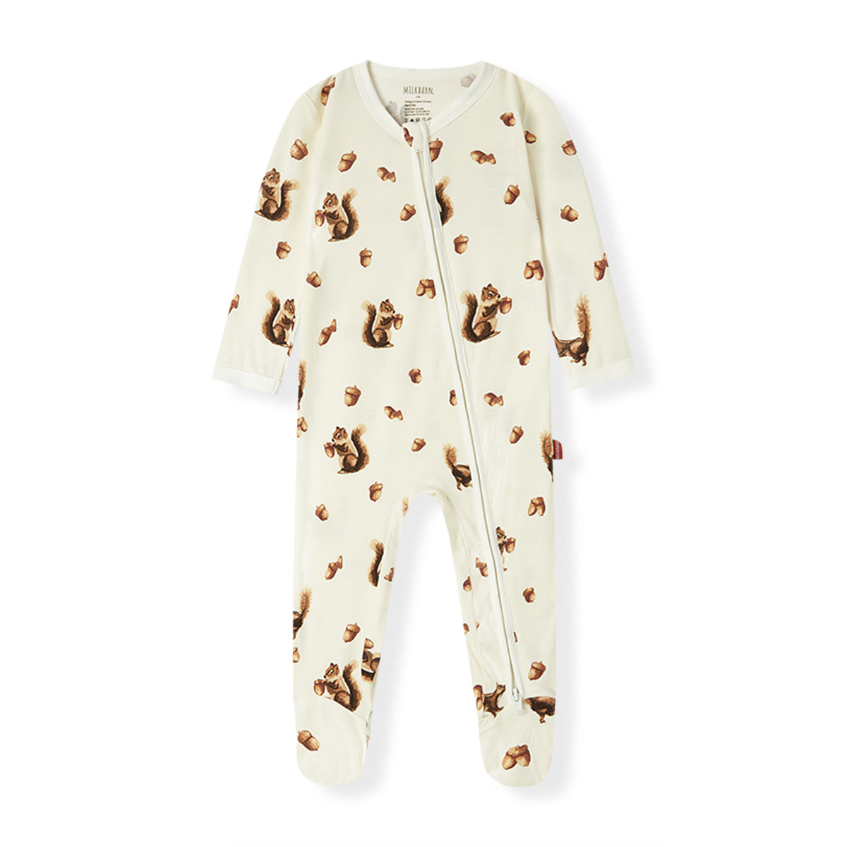 A baby footed sleeper in cream with a brown squirrel and acorn print, shown flat against a white background.