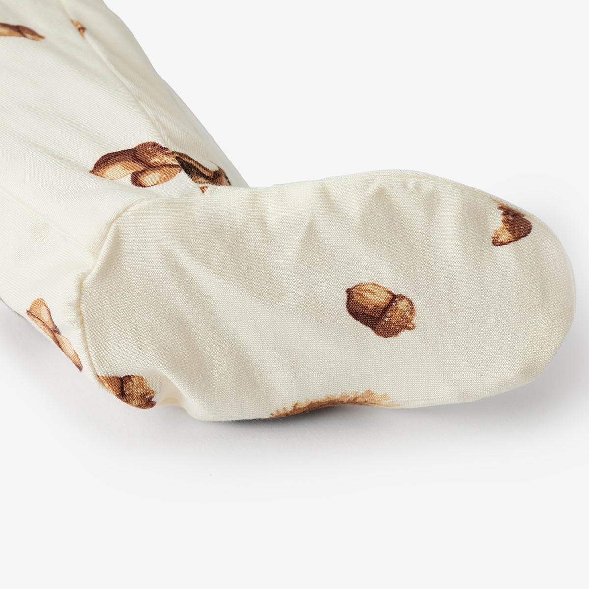 Beige oven mitt with acorn pattern on a white background