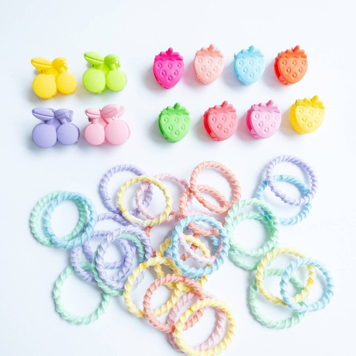 Colorful hair ties and hair accessories on a white background