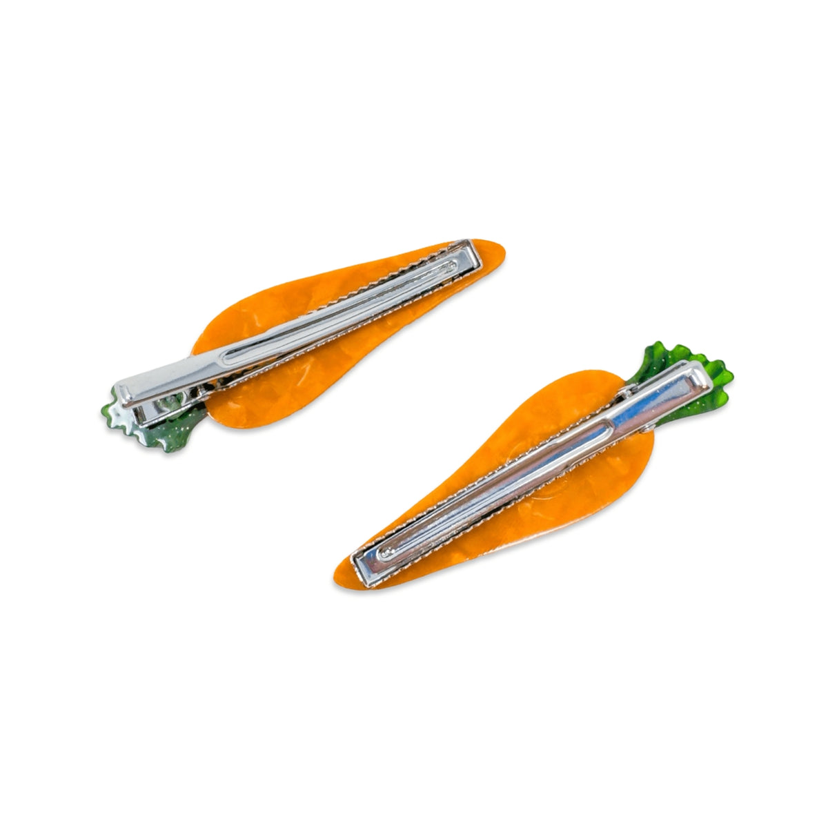 Two carrot-shaped hair clips with silver blades on a white background