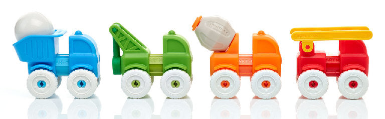 Set of colorful toy construction vehicles on a reflective surface