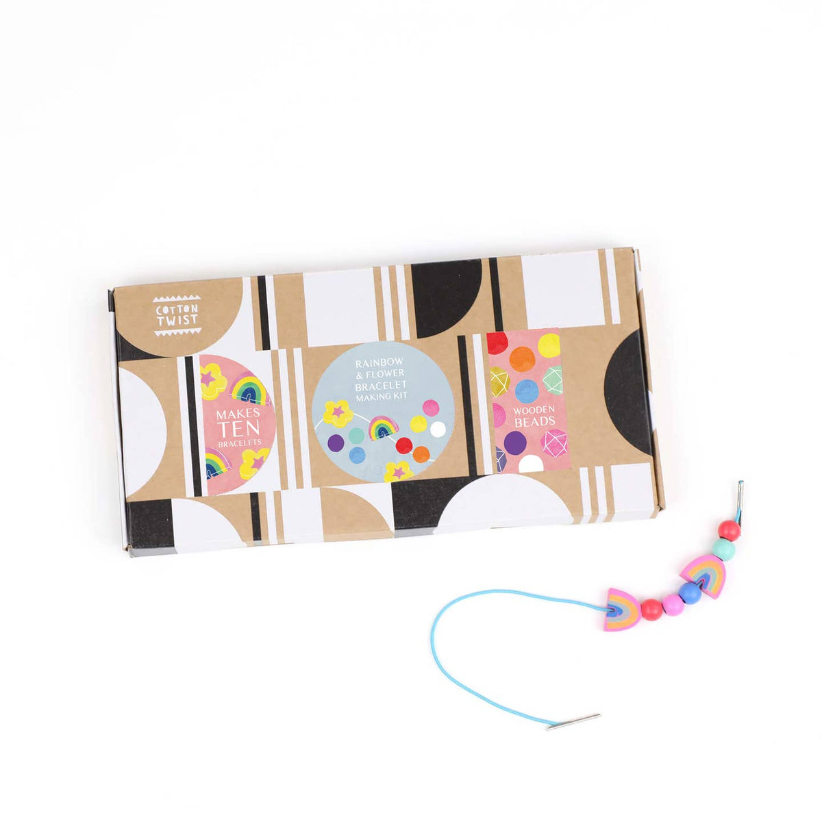 Craft kit packaging with colorful beads and string on a white background