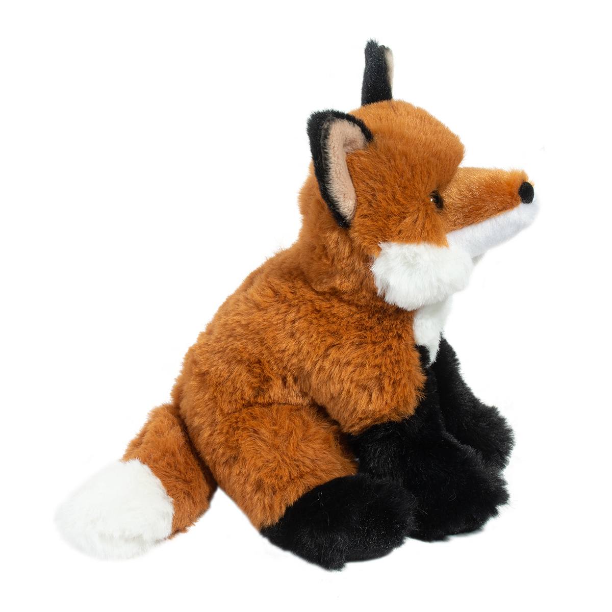 Plush toy fox sitting on a white background