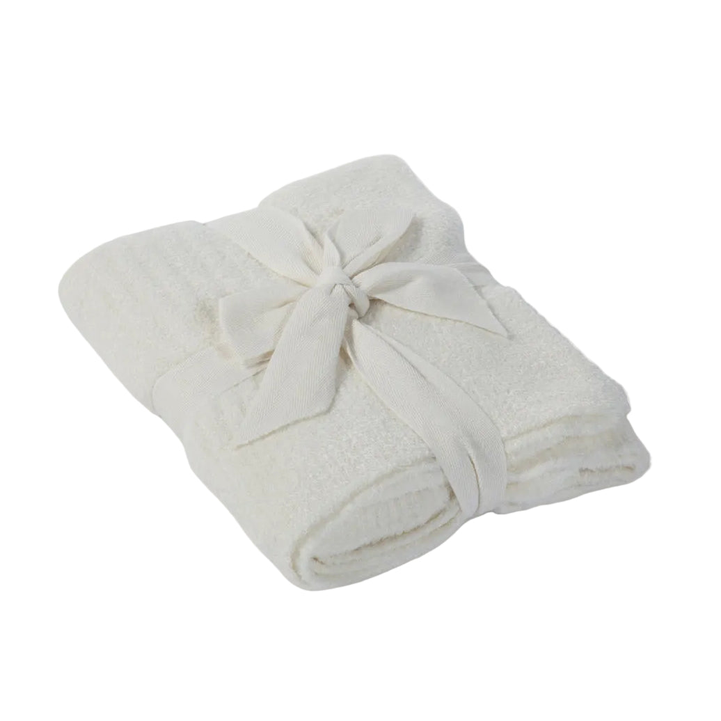 Folded light gray towel on a white background