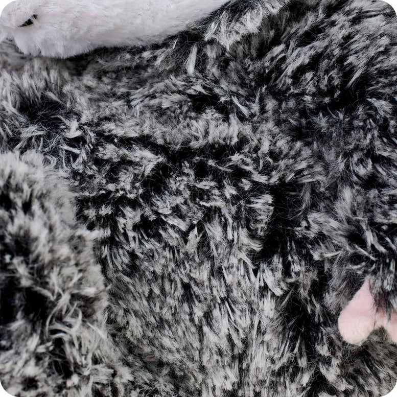 A close-up view of the black and gray textured faux fur on the back of the Opossum by Warmies stuffed animal.