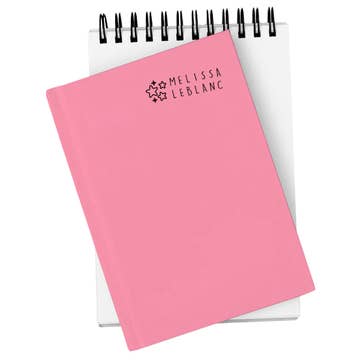 Pink notebook with 'Melissa LeBlanc' branding on a white background