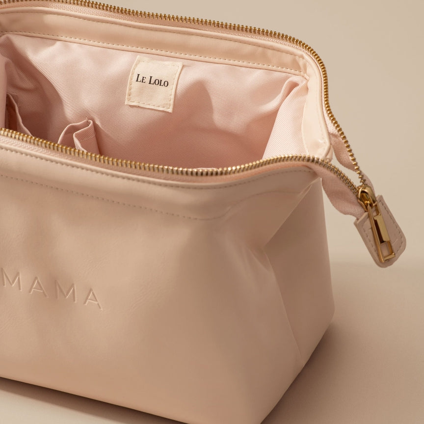 Beige cosmetic bag with 'MAMA' and 'Le Labo' branding on a beige background