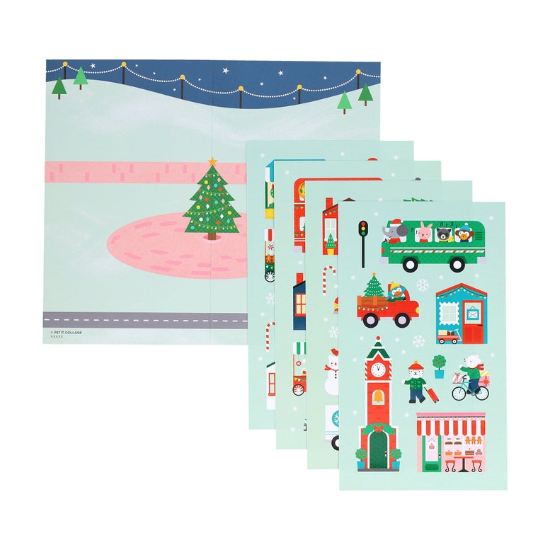 A product photo of the Christmas Town Mini Sticker Set by Petit Collage featuring layered sticker sheets with festive illustrations of holiday scenes, vehicles, buildings, and characters.