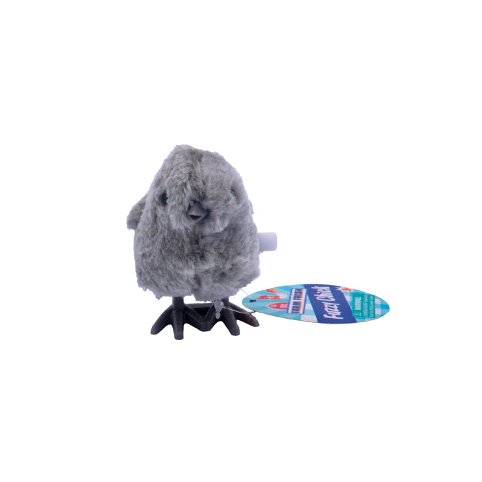 Gray plush toy on a stand with a blue label on a white background