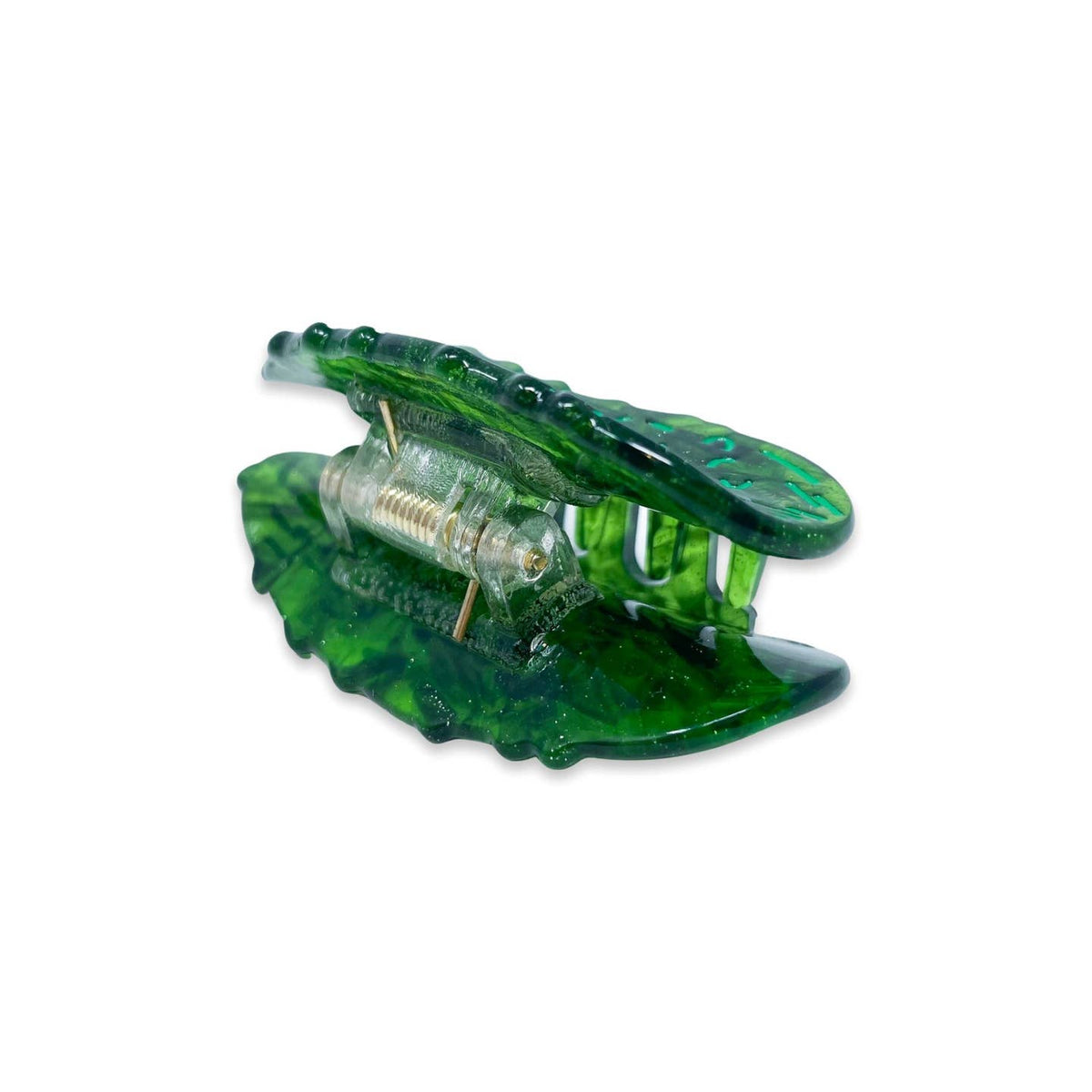 Green hair clip with clear center on a white background