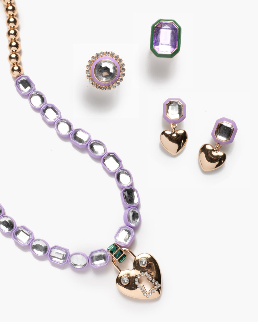 Jewelry set with heart-shaped pendants on a white background