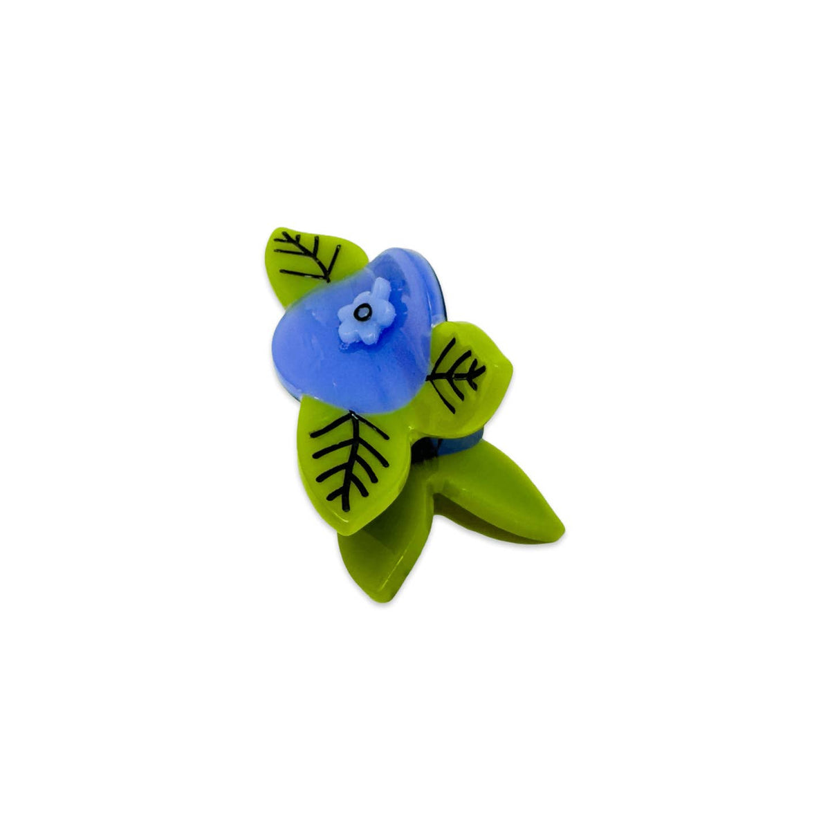 Small decorative item with blue center and green leaves on a white background