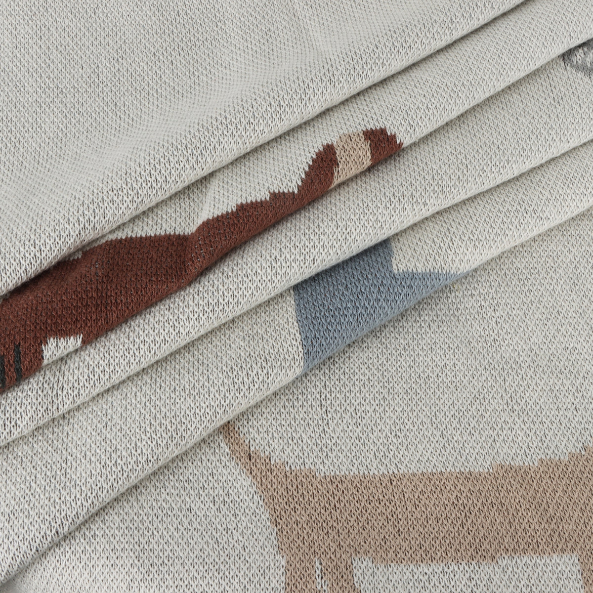Close-up of fabric with animal patterns on a neutral background