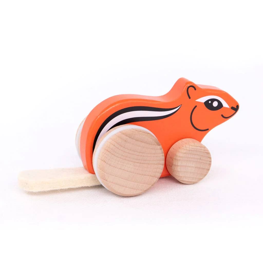 Wooden toy squirrel on a white background