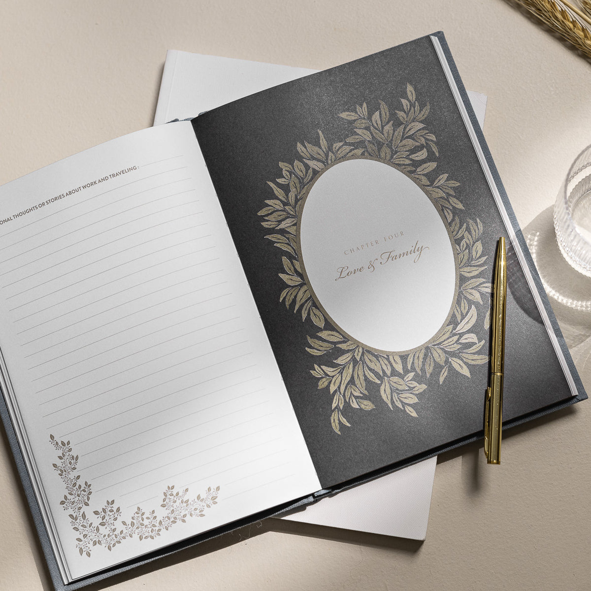 Open notebook with decorative cover and pen on a light surface