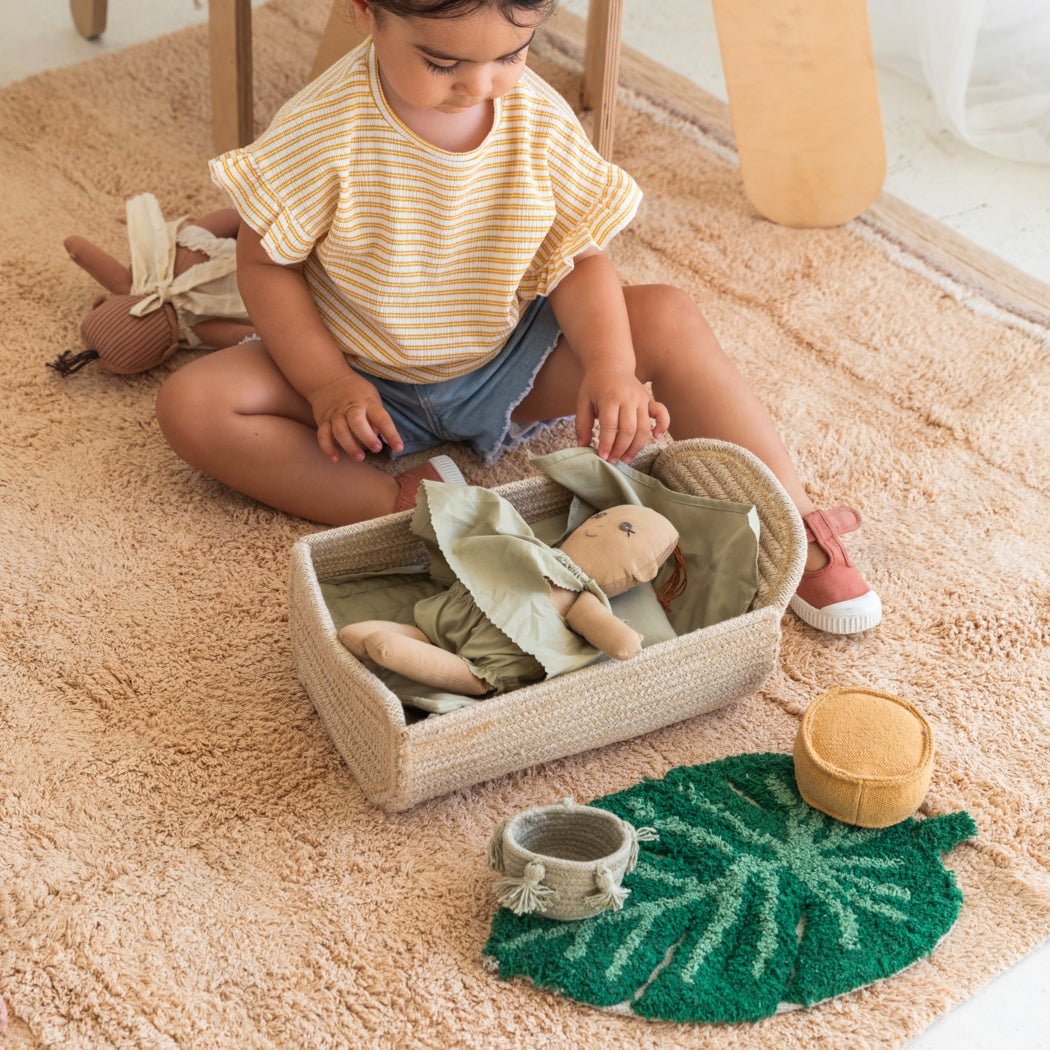 Child playing with toys on a carpeted floor