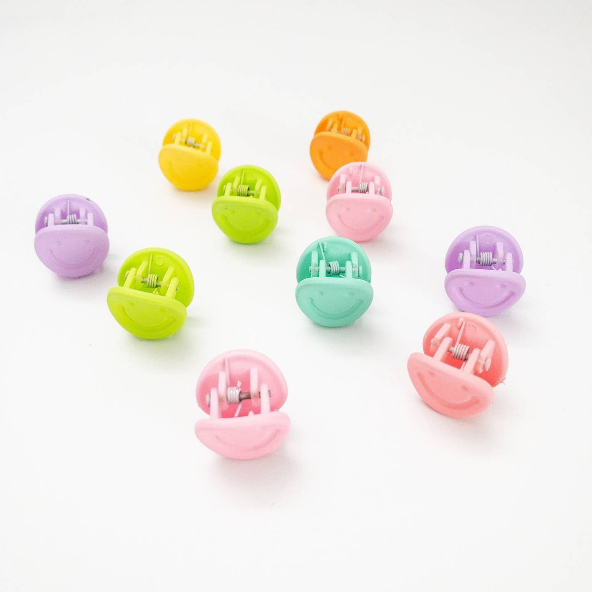Set of colorful small round objects on a white background