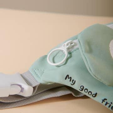Light blue baby outfit with text on a beige background
