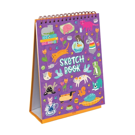 Sketchbook with colorful animal illustrations on a purple background