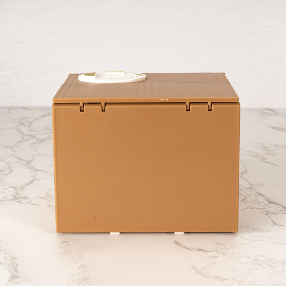 Brown cardboard box on a marble surface