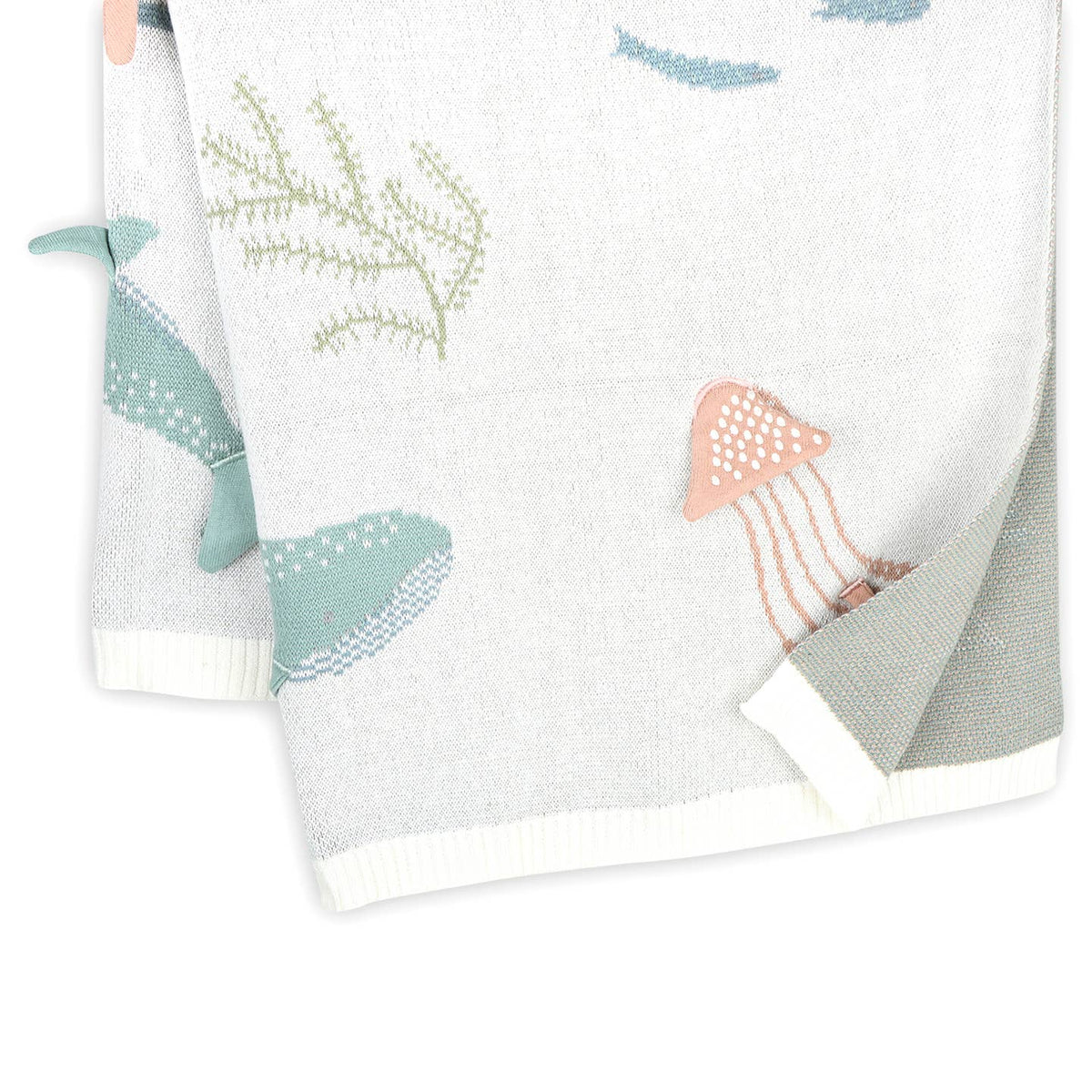 Set of two towels with whale and jellyfish designs on a white background