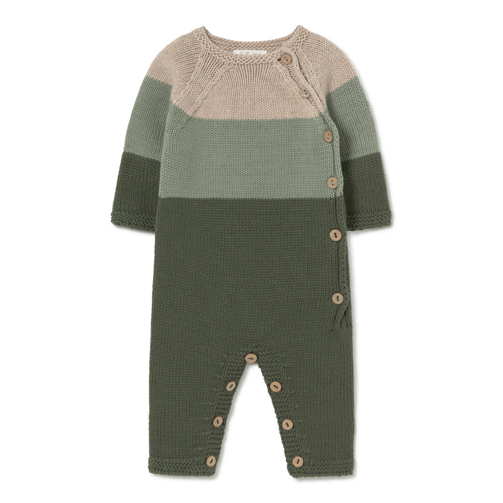 A baby knit romper in horizontal color-blocked stripes of beige, sage green, and dark olive green, featuring wooden buttons on the side and crotch.