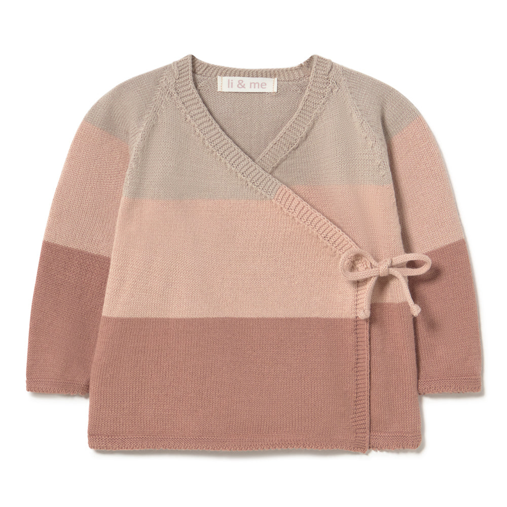 A children's knit wrap cardigan sweater with horizontal color-blocked stripes in beige, dusty pink, and mauve, featuring a crossover V-neck and a side tie detail. The brand label 'li & me' is visible inside the collar.
