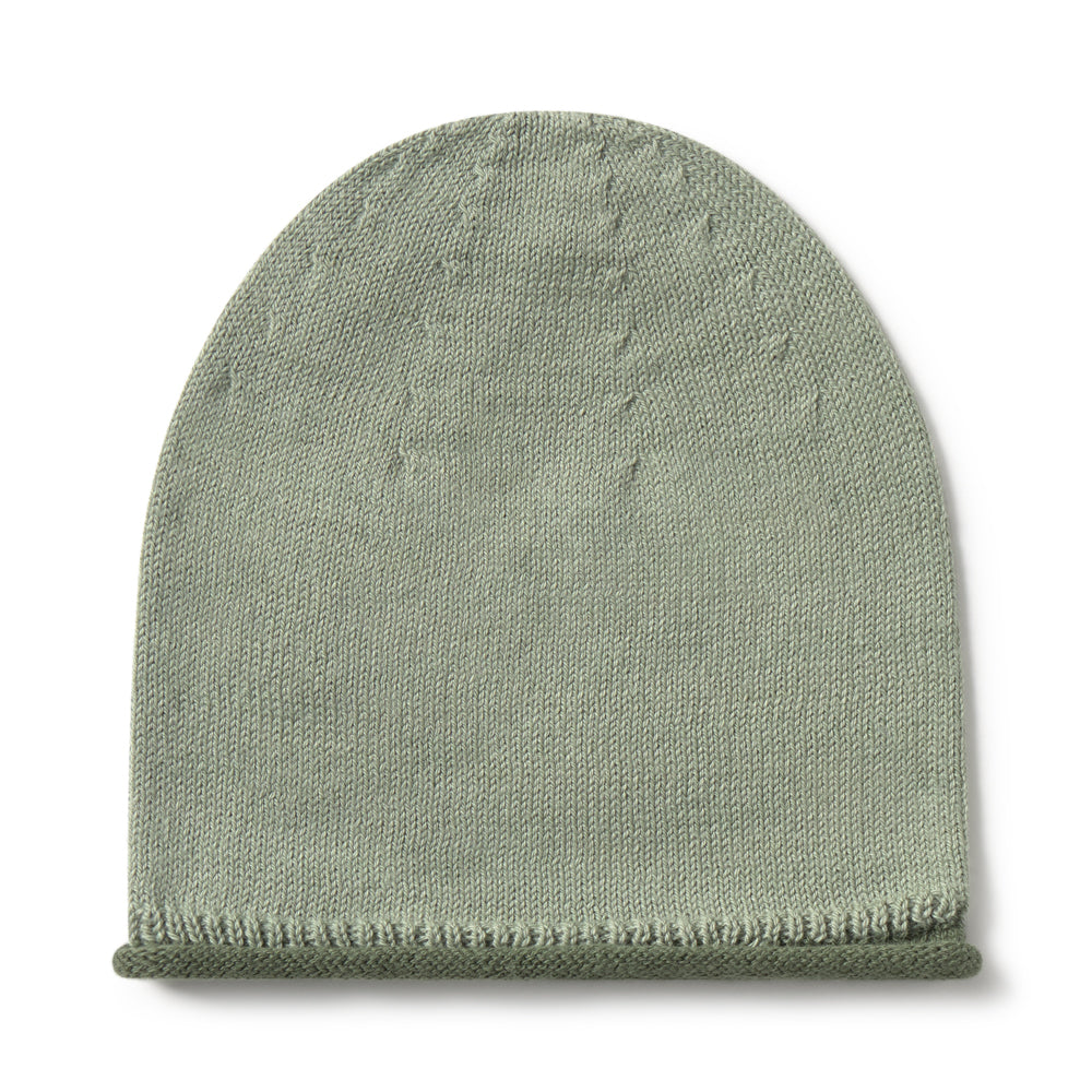 A light sage green knit beanie hat with a ribbed cuff, shown flat against a solid white background.