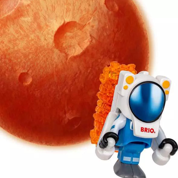Brio World astronaut figure wearing a blue and white spacesuit with an orange backpack, standing in front of a red planet surface.
