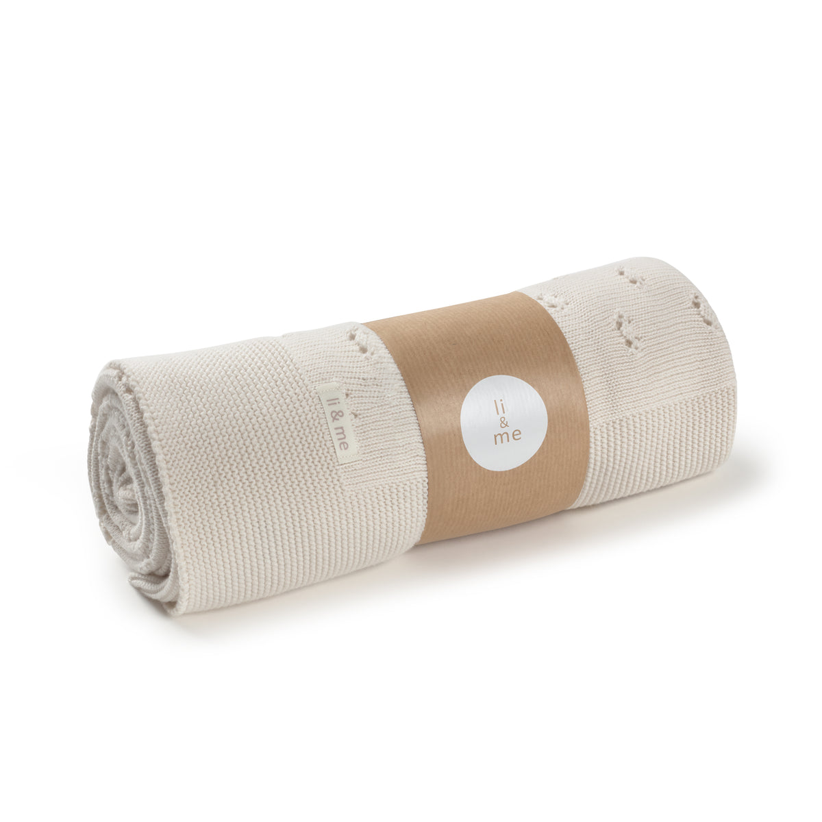 Rolled-up blanket with a brown label on a white background