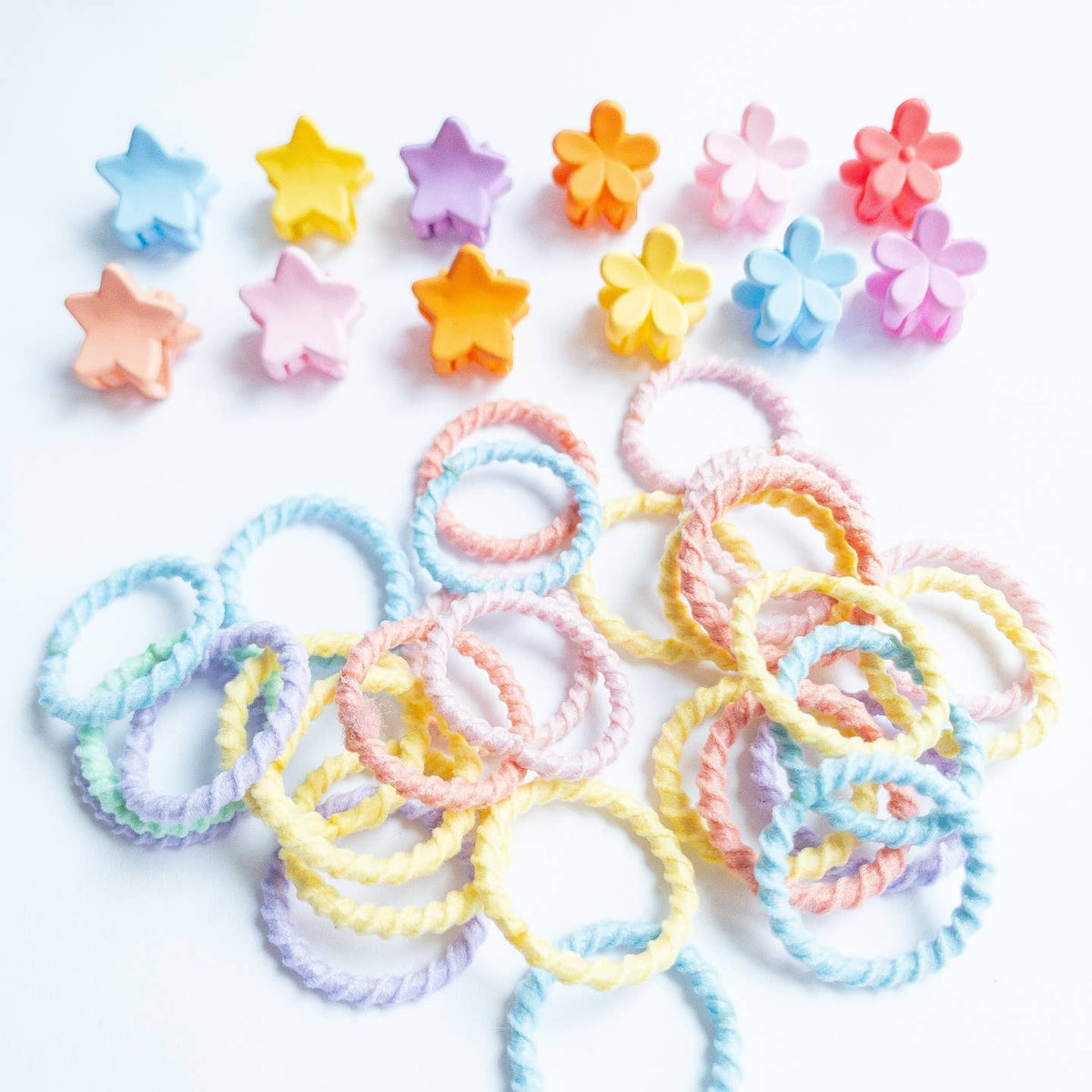 Colorful hair ties and hair accessories on a white background