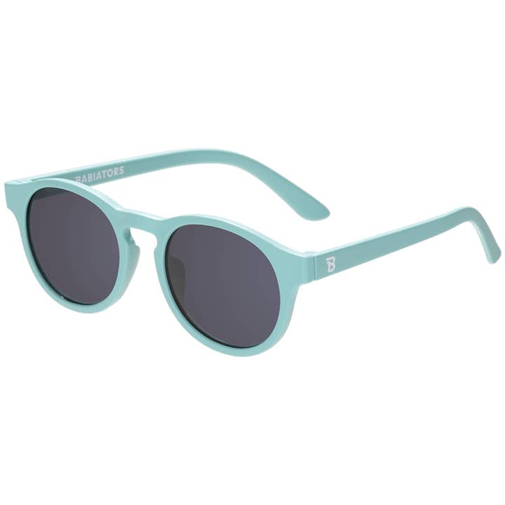 Light blue sunglasses with a brand logo on a white background