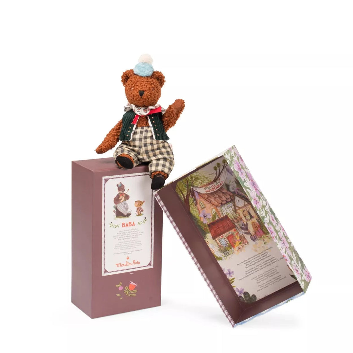 Teddy bear in a checkered outfit with a decorative box on a white background