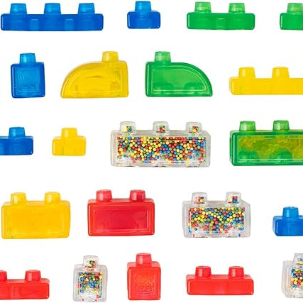 A collection of 30 colorful, translucent squishy building blocks from the Jelly Blox Stash 'n' Stack set, arranged neatly against a white background in various shapes, sizes, and textures, including special sensory pieces filled with colorful beads.