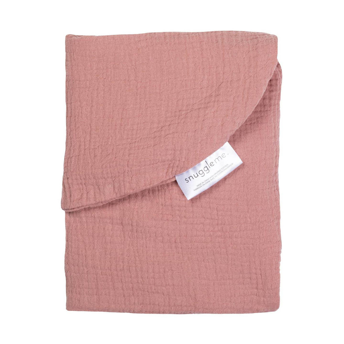 A folded dusty pink muslin baby blanket with a white Snugglerme brand tag, shown on a clean white background.