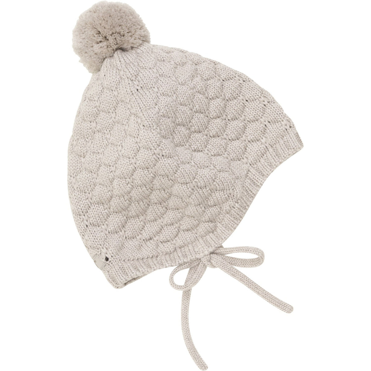 Knitted baby hat with pom-pom on a white background