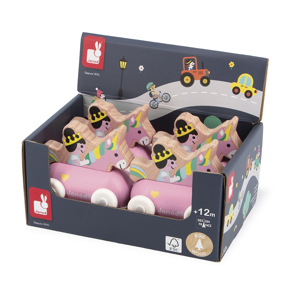 A boxed set of wooden toy cars by Janod, displayed in a dark navy retail box with colorful printed illustrations. The cars are pink with wooden roofs decorated with cartoon faces, yellow accents, and small white wheels.