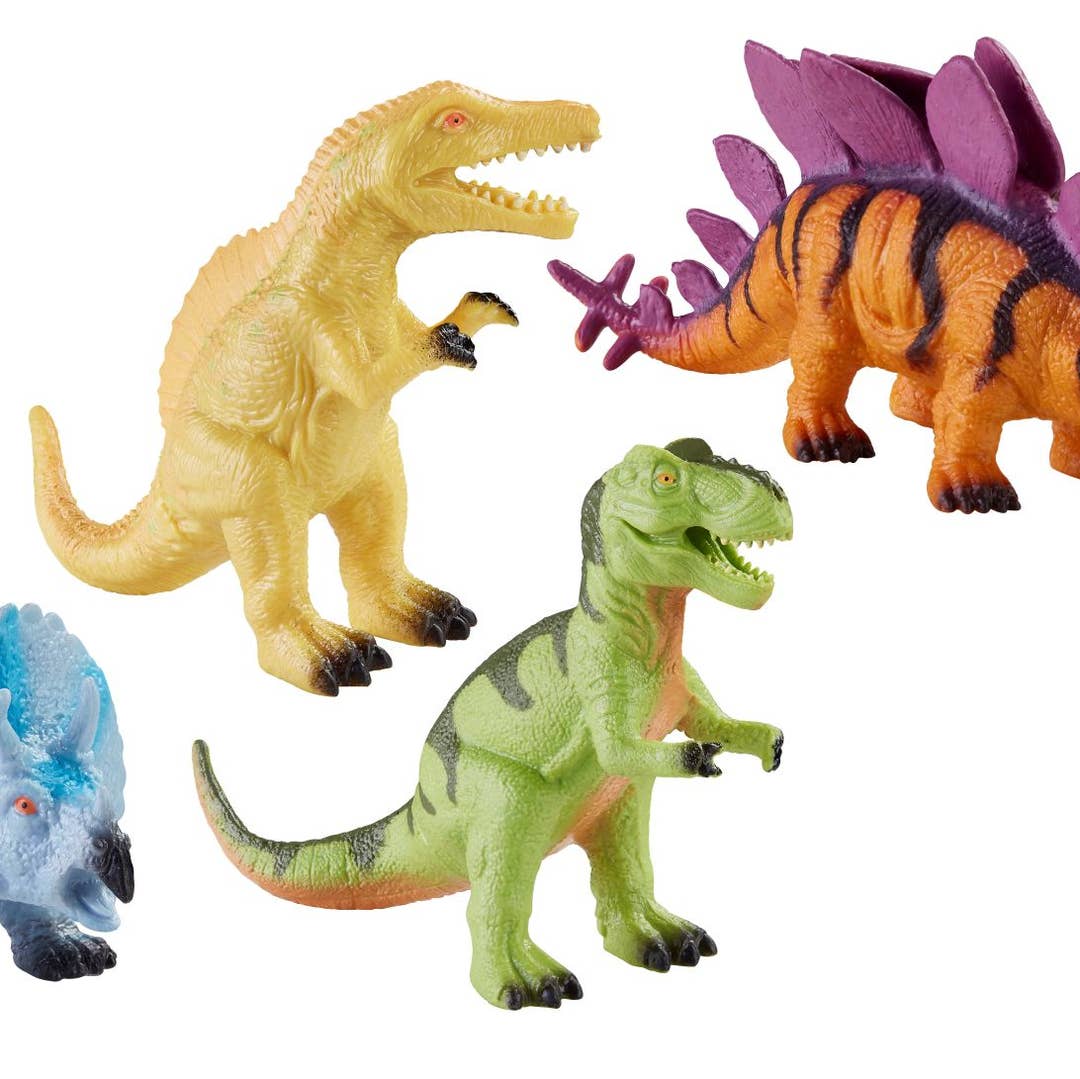 Set of colorful dinosaur toys on a white background