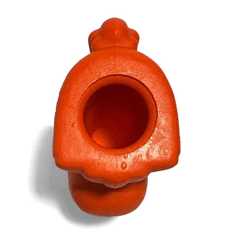An orange-red ceramic pipe or smoking vessel with a wide central opening, photographed on a plain white background with a soft shadow.