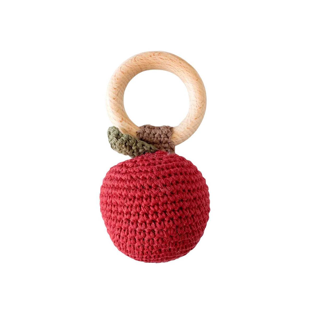 Crocheted red ball with a wooden ring on a white background