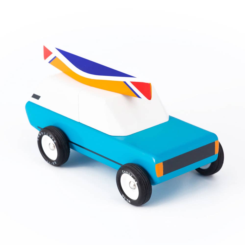Toy car with a colorful roof on a white background