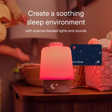 Pink night light with 'Pink Noise' label on a wooden surface, text about creating a soothing sleep environment.