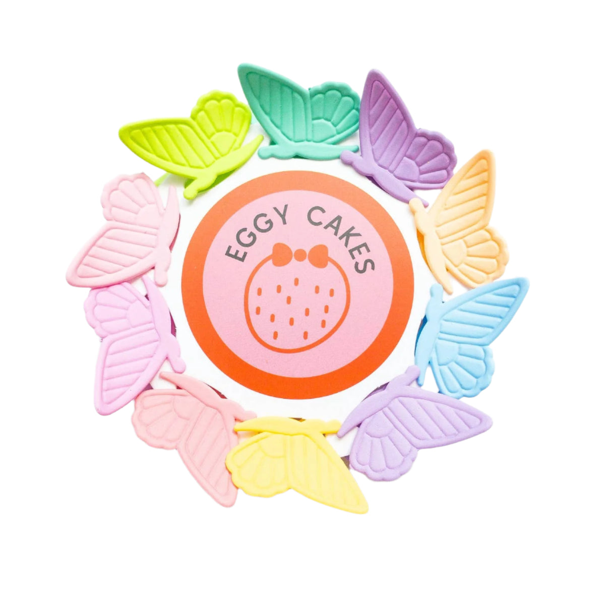 Pastel-colored butterfly-shaped cookies around a pink circular cookie with 'Eggy Cakes' branding on a white background.