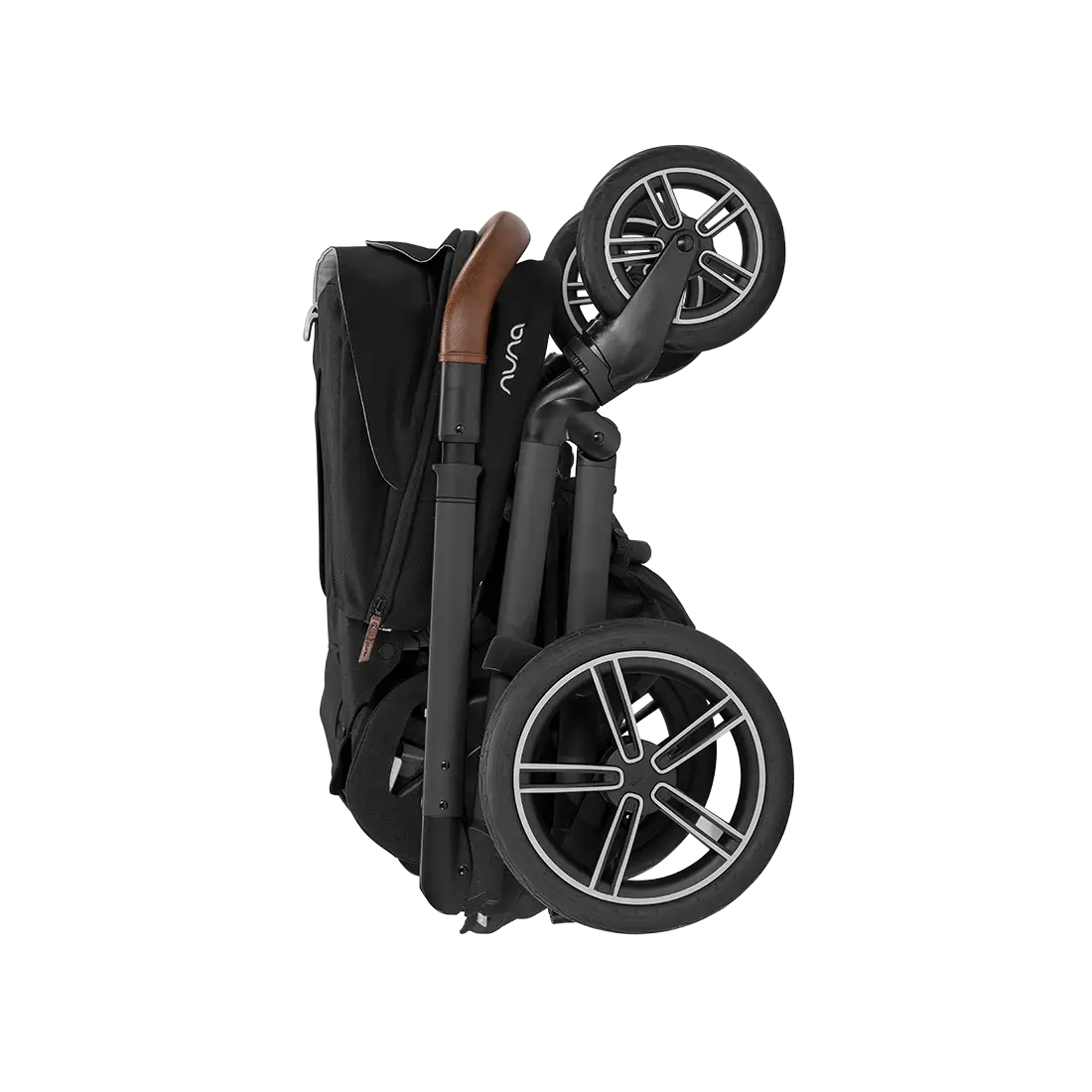 A profile view of a folded black MIXX Next + Pipa Aire RX Travel System by Nuna stroller featuring a compact fold with an exposed brown leatherette handlebar, set against a checkered transparent background.