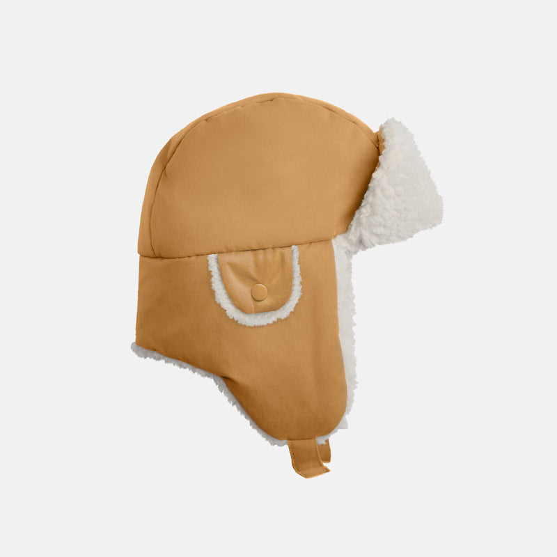 The Benji Sherpa Chapka Hat by 7AM Enfant in cognac, shown from the side against a white background.