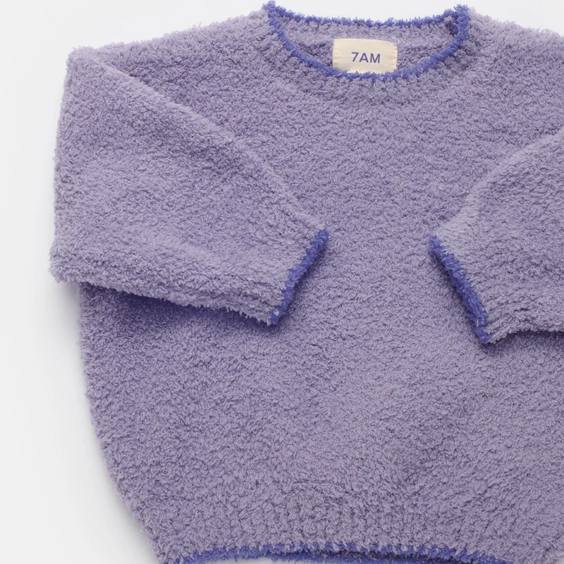 A lavender purple textured fleece crewneck sweater with long sleeves, laid flat on a white background. The brand label inside the collar reads '7AM'.