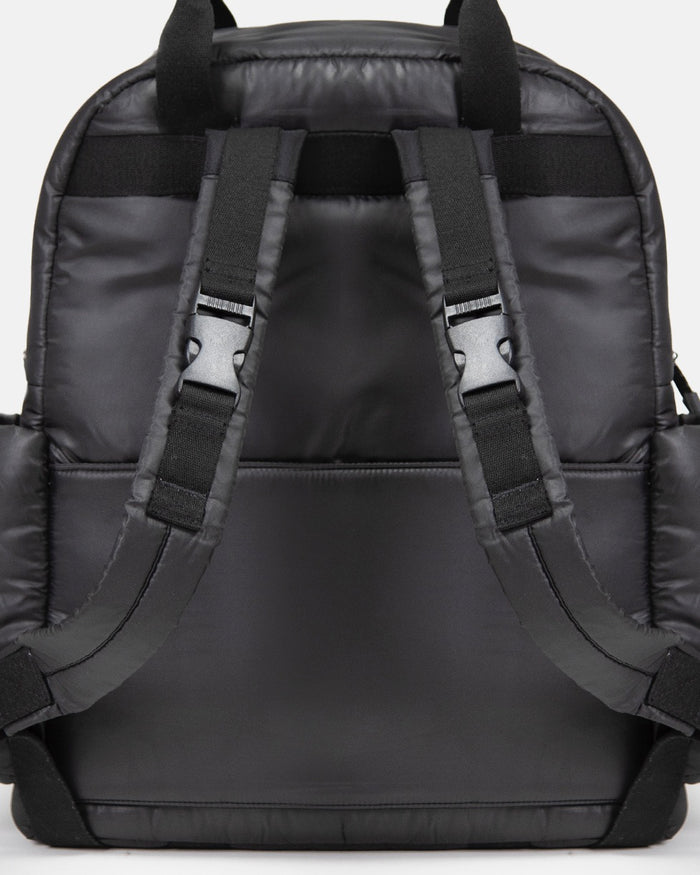 Black backpack with straps on a light gray background