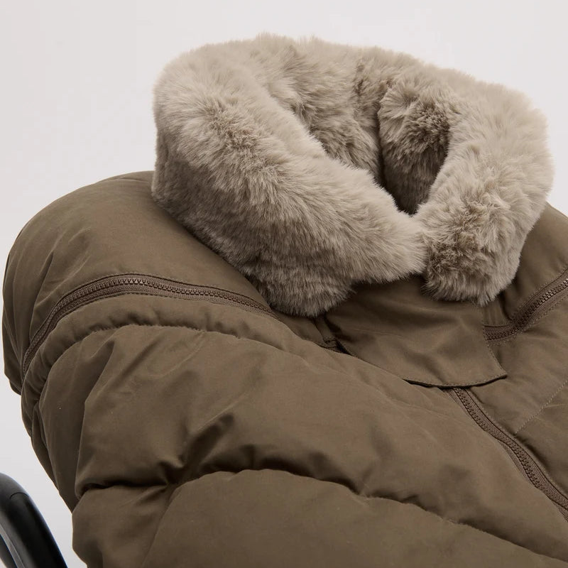 Close-up of the moss brown Helsinki Car Seat Cocoon by 7AM Enfant highlighting the plush faux-fur collar and quilted texture.